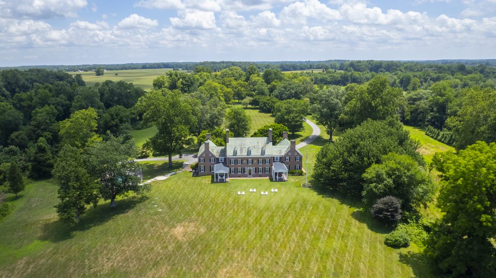 Aerial view of Bohemia Manor Farm, an East Coast retreat venue surrounded by open land and natural scenery.