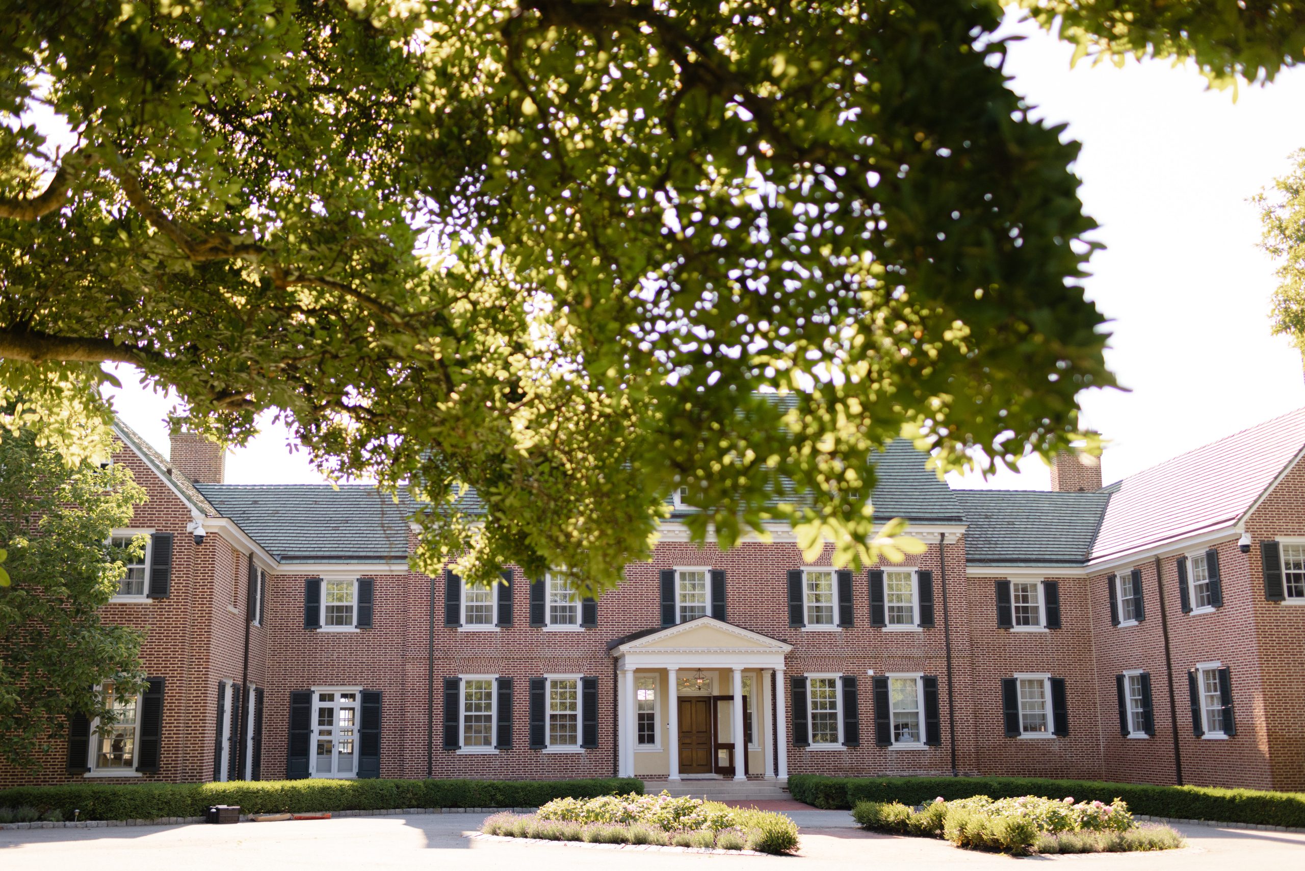 An exterior photo of the front facade of The Manor House at Bohemia Manor Farm